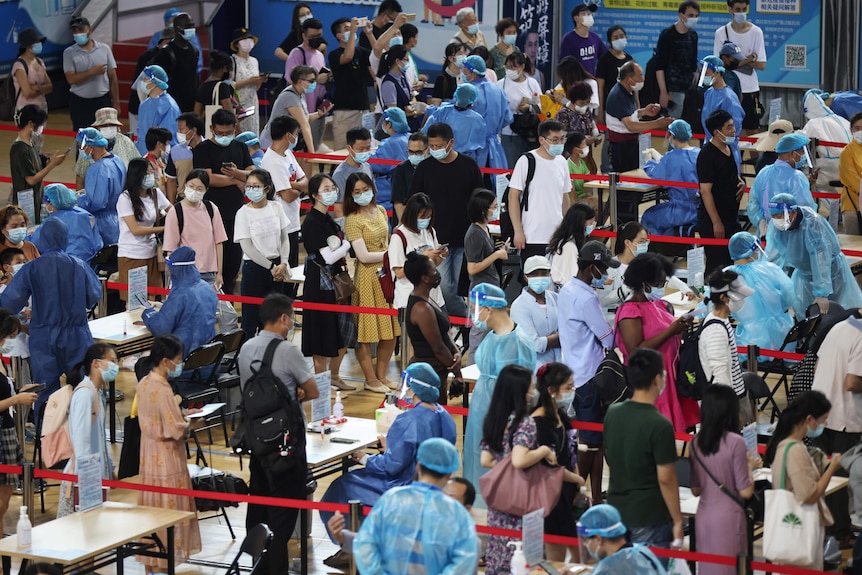 China undertakes mass testing in Nanjing as COVID surges, while Thailand  sees record cases for second day running - ABC News