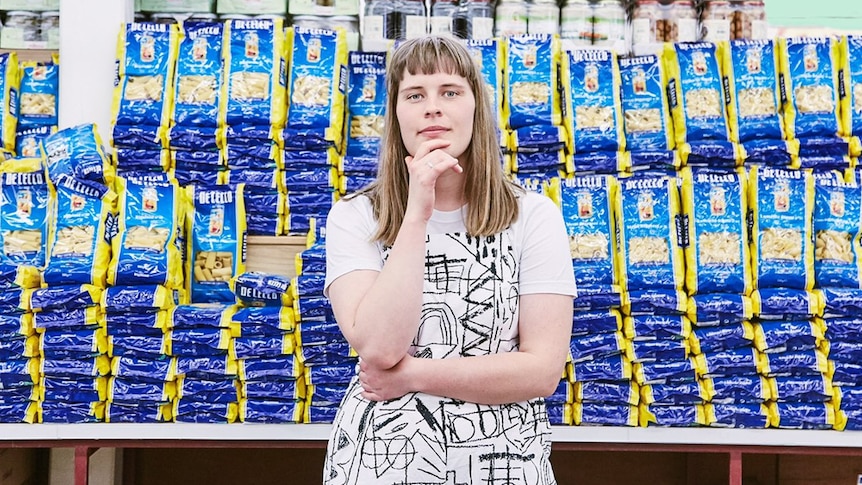 A 2018 press shot of Alice Ivy in a supermarket aisle stocked with pasta