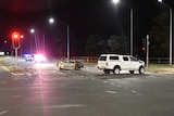 The scene of a car crash at night.
