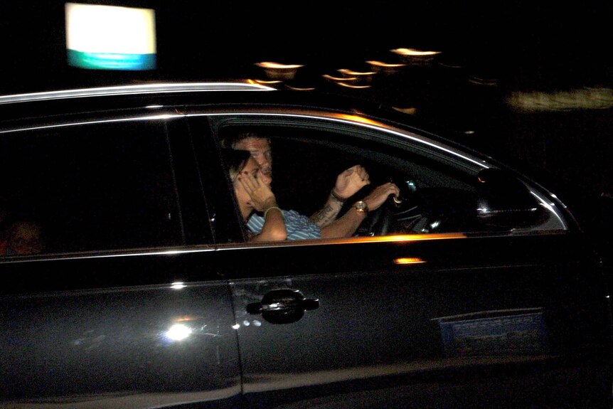 David Beckham and Victoria Beckham in a car