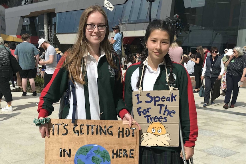 Ruby (L) and Sian (R) from Devonport attend a climate change rally. 20 September 2019.