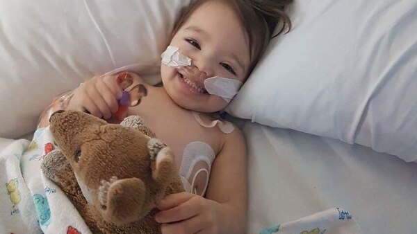 Eli Vale in hospital holding a teddy bear