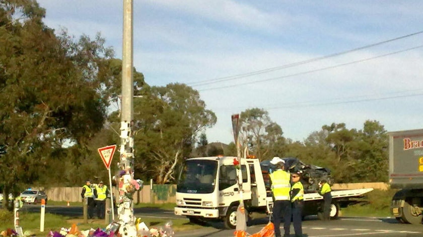 Police say the driver may have been distracted by the roadside tribute.