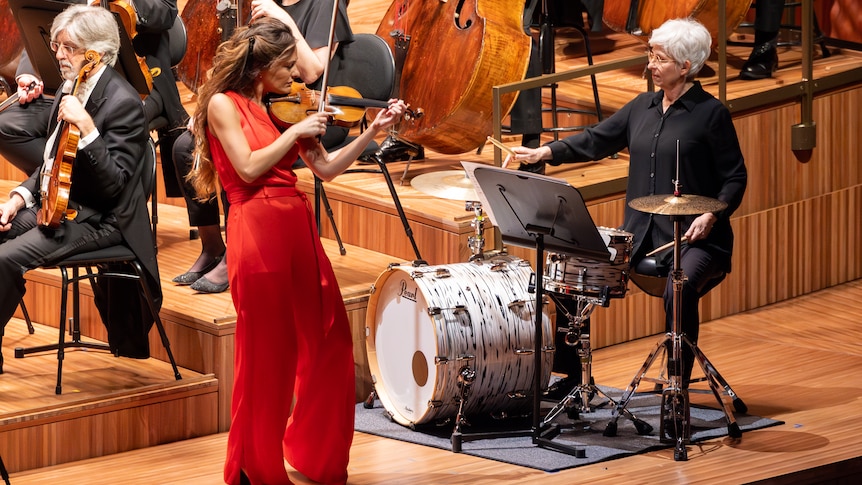 Violinist Nicola Benedetti and drumkit player Rebecca Lagos with the Sydney Symphony Orchestra