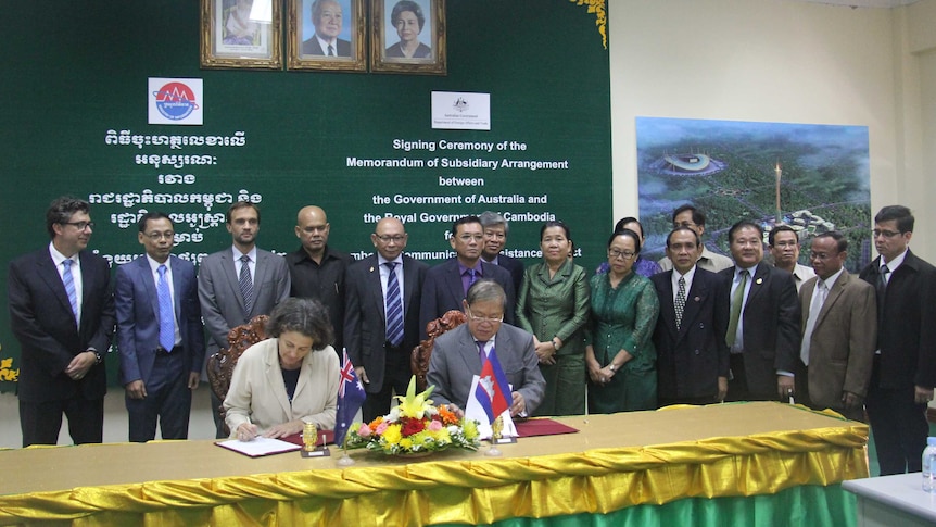 Cambodian Minister of Information Khieu Kanharith and Australian Ambassador to Cambodia Alison Burrows signing CCAP2