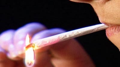 Woman lights a joint (ABC-TV)