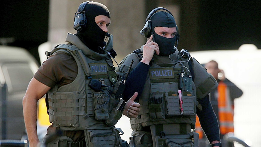 Special police operate outside the Cologne train station.