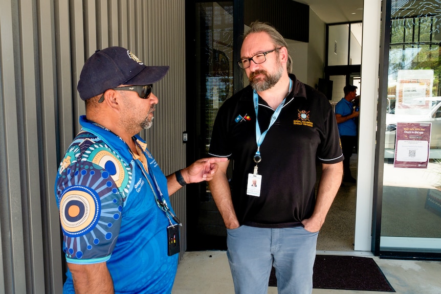 Dr Jason King speaks with a health worker.