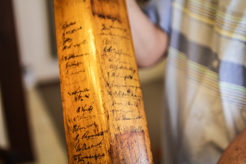 The Bodyline cricket bat has Don Bradman's signature third from the top right hand side.