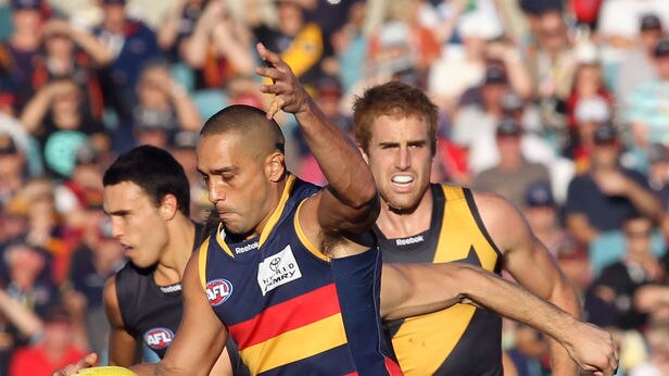 Crows legend Andrew McLeod is disappointed with the racism row engulfing the club