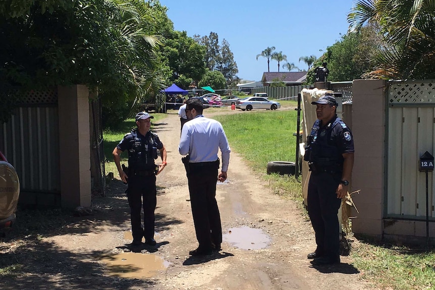 Queensland police on the scene of a fatal shooting at Carrara
