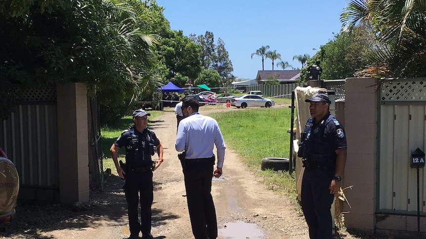 Queensland police on the scene of a fatal shooting at Carrara