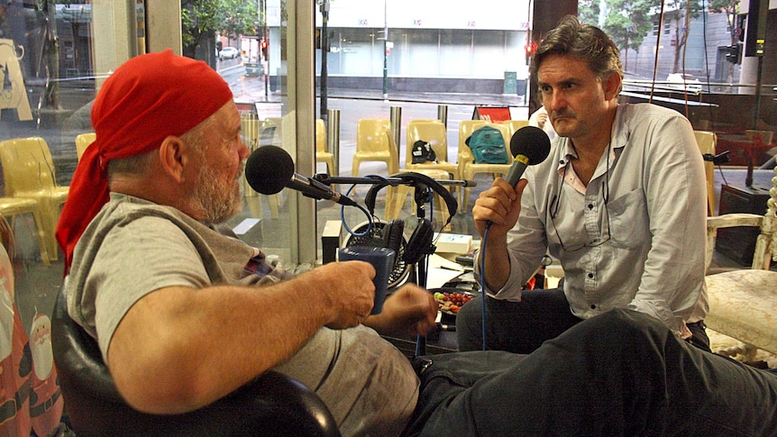 LtoR Peter FitzSimons and Richard Glover pass the 20-hour mark during their world record interview.