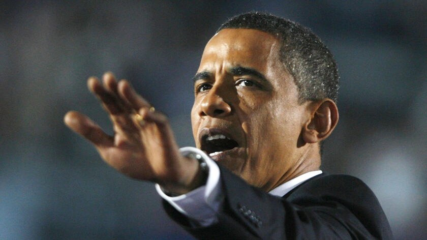 Obama gestures while giving acceptance speech