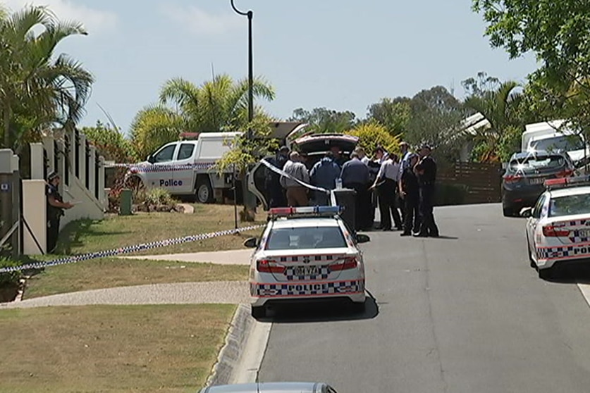 Police officers and vehicles at the scene where Radica Zafirovska was found bludgeoned to death in her home at The Gap.