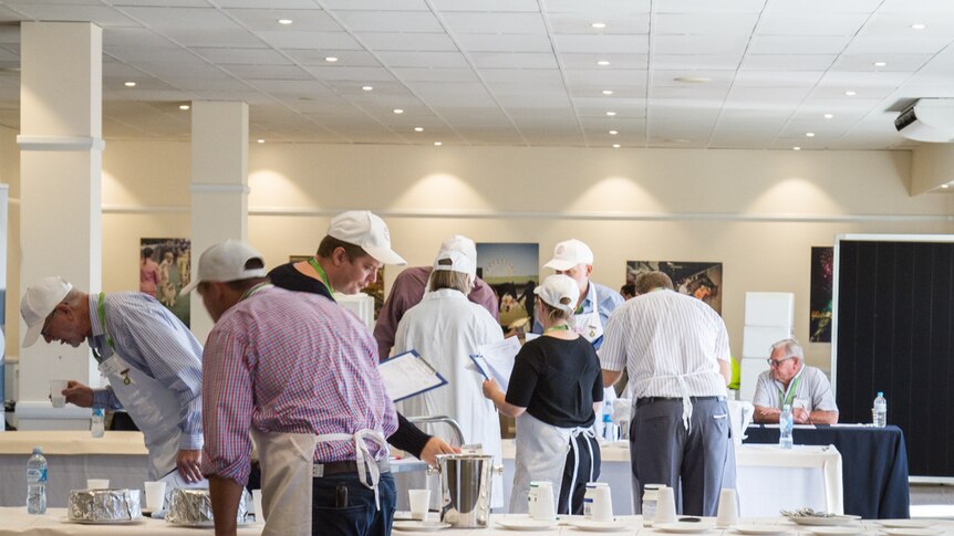 Judges take final notes in the non-bovine category.