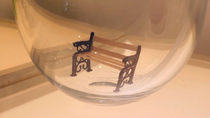 Small chair inside of glass