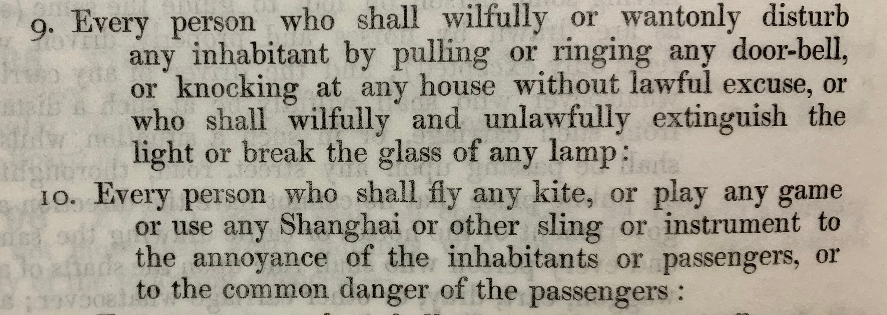 Close-up of text detailing laws around unacceptable street games including kites and pranks