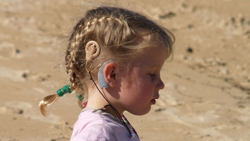 A child with a cochlear implant.