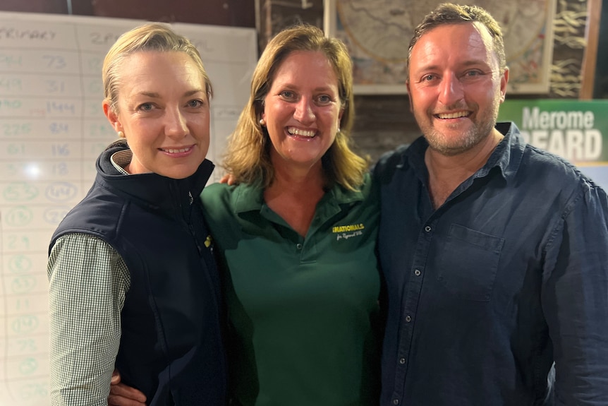 Mia Davies, Mem Beard, and Vince Catania smile at the camera