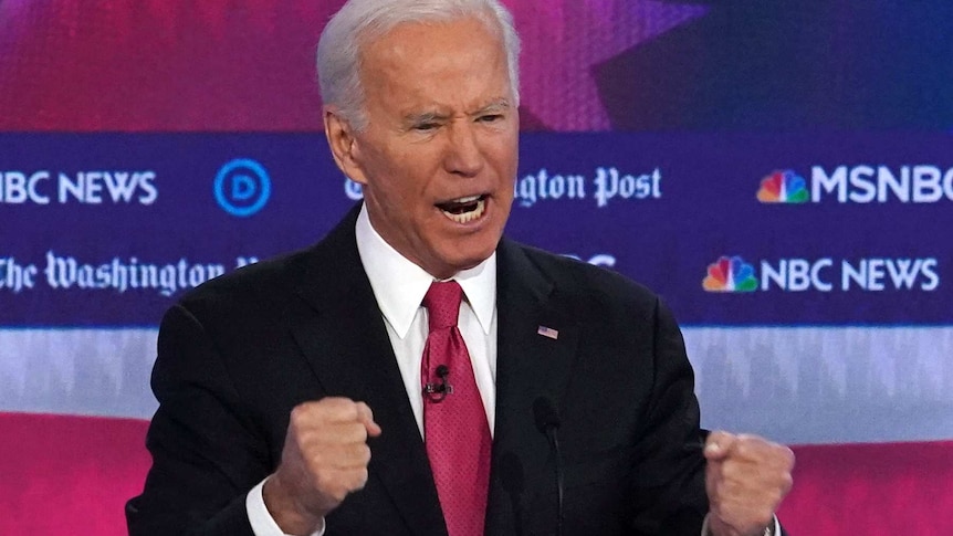 Former Vice President Joe Biden speaks while clenching fists