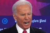 Former Vice President Joe Biden speaks while clenching fists