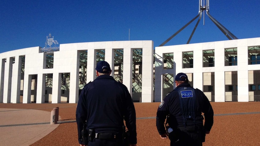 Police patrol at Parliament House in Canberra