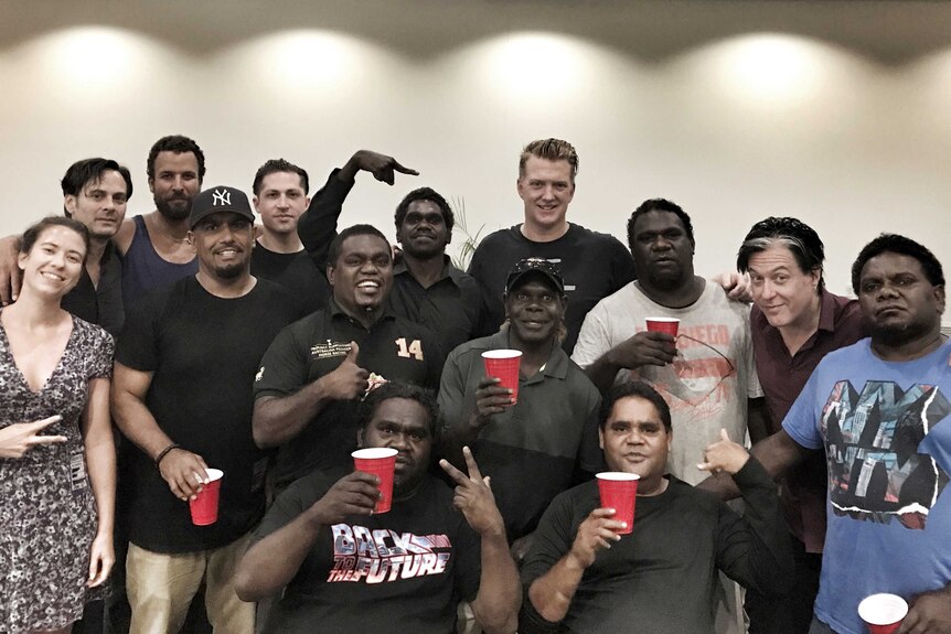 The Lonely Boys and Queens of the Stone Age pose together in Darwin