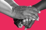 Two sets of hands grasping each other in a show of support to illustrate delivering bad health news after a diagnosis.