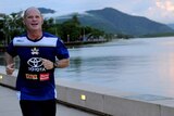 Mr Newman takes an early morning run in Cairns