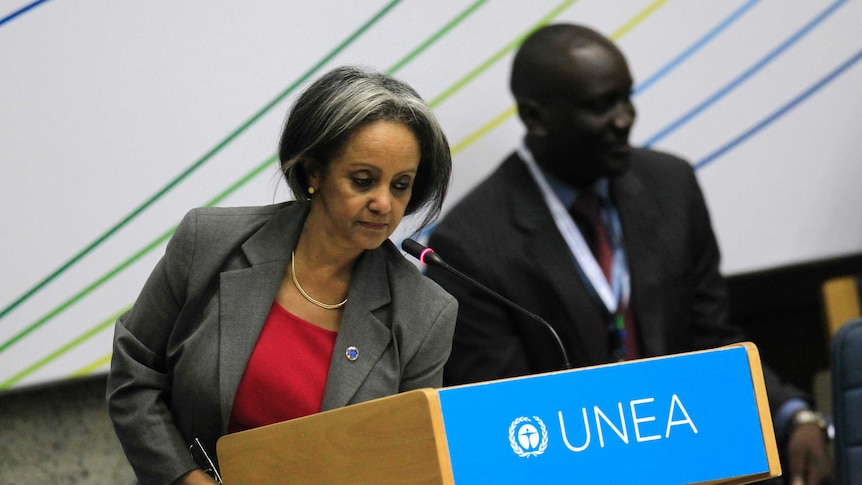 Sahle-Work Zewde is in a large room and  holding a large box for work she did for United Nations Environment Assembly