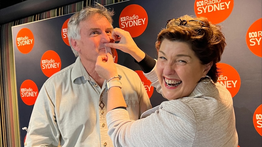Physiotherapist Anna-Louise Bouvier taping Richard Glover's mouth