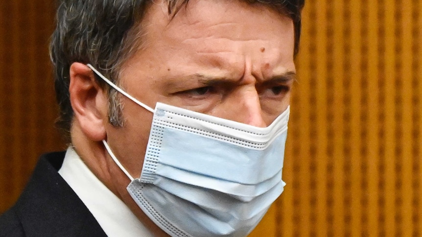Close up of man's face wearing mask.