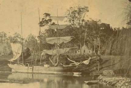 A sepia photo of a 1800s sailing ship.