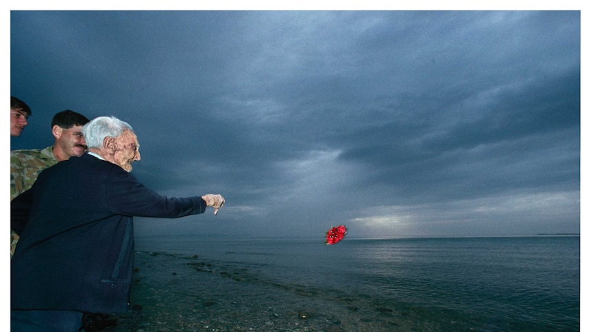 Jack Ryan throws wreath into the sea