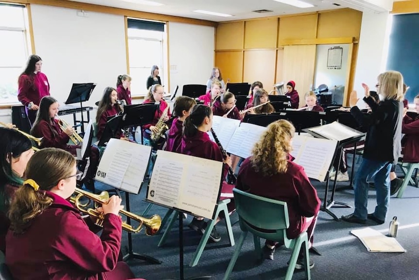 High school students in a brass band rehearsal