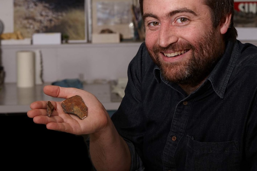 Dr Erich Fitzgerald with sea turtle fossils