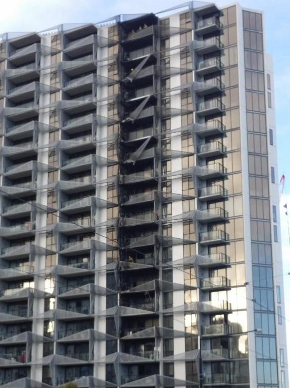 Exterior daytime of damaged apartment building