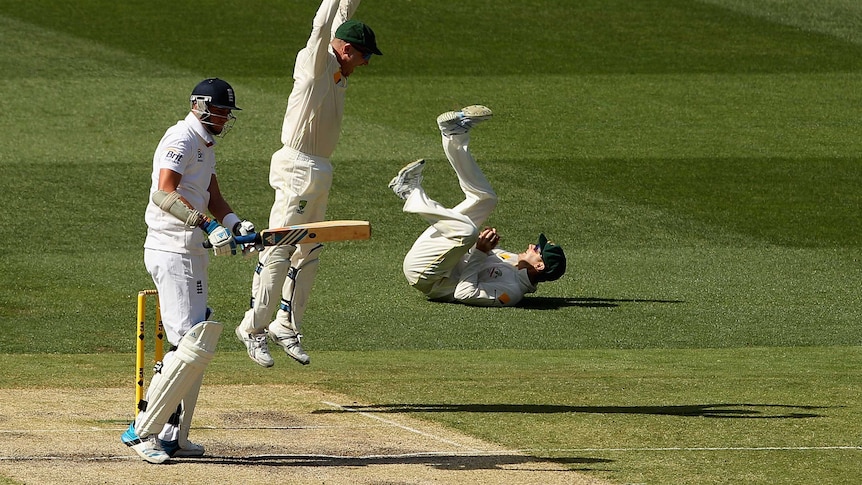 Australia's Michael Clarke takes a catch to dismiss England's Stuart Broad on day three at the MCG.