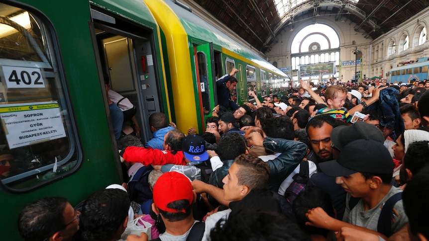 Asylum seekers storm a train at Keleti station, Budapest