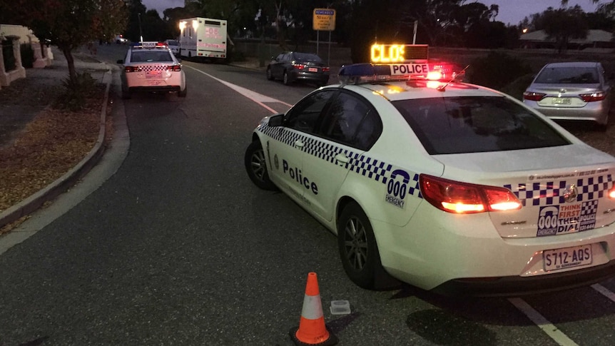 South Australian police cars block access to an Adelaide street