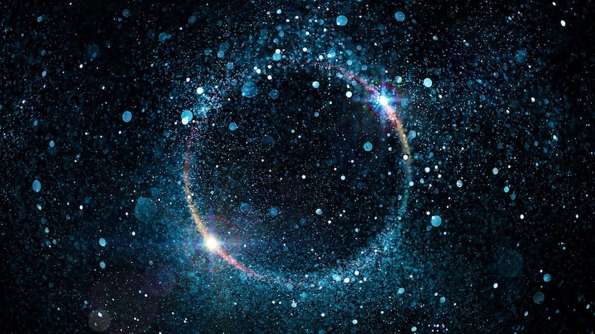 An abstract image showing a cluster of glittering, shiny particles swirling around a black hole