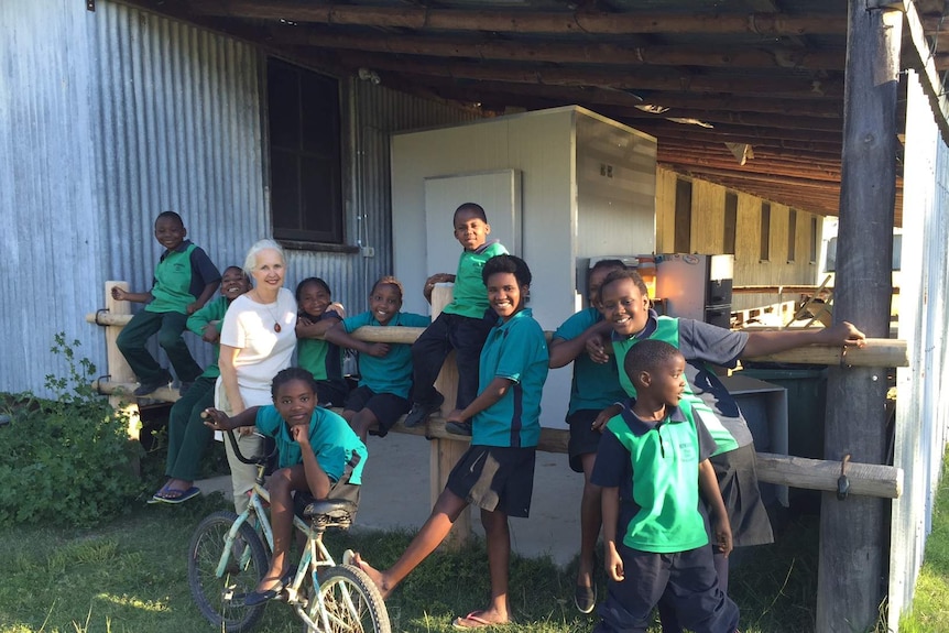 Julia with school children