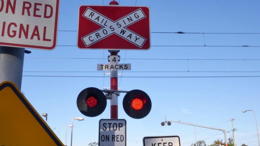 A railway crossing sign. 