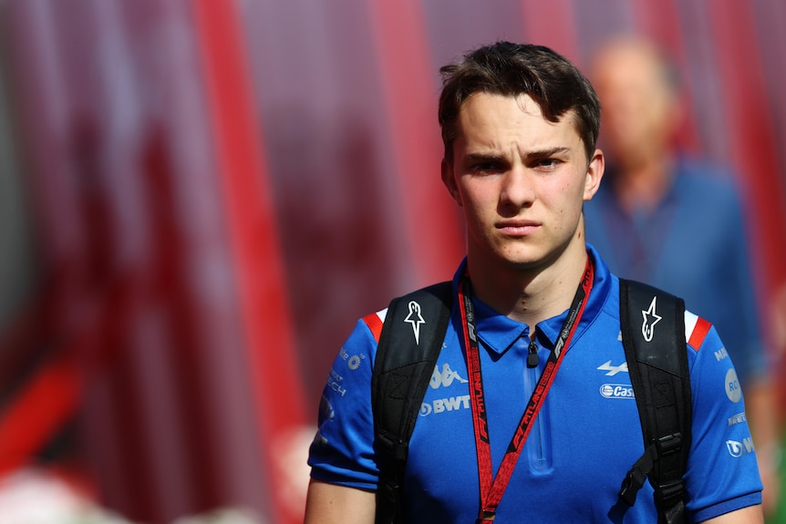 Oscar Piastri walking through the F1 paddock in Spain.