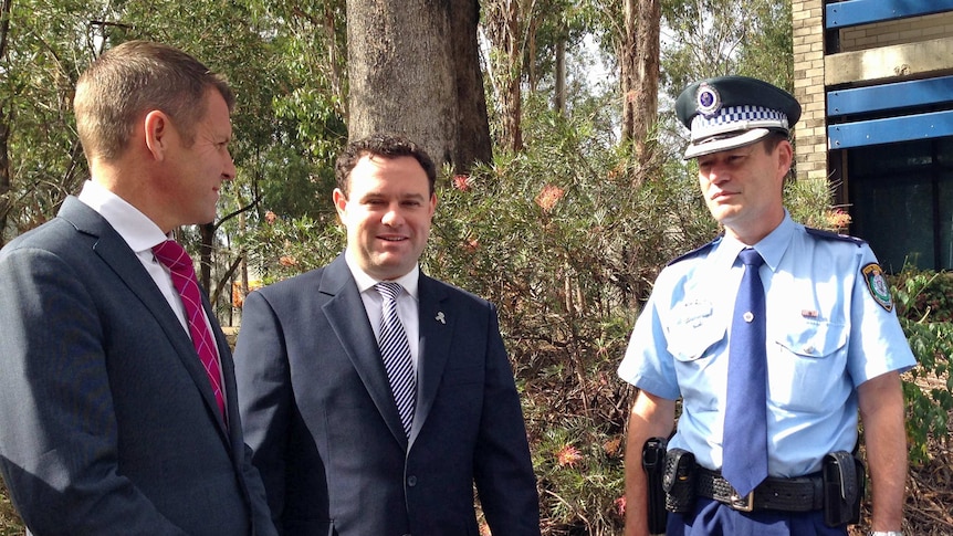 NSW Premier Mike Baird and Police Minister Stuart Ayres (left and middle) meet a police officer