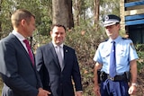 NSW Premier Mike Baird and Police Minister Stuart Ayres (left and middle) meet a police officer
