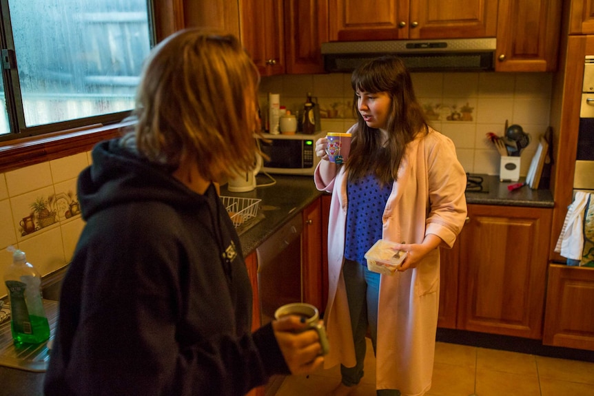 Shannon Colee sips a cup of tea in her kitchen.