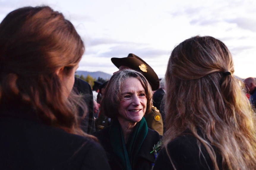 Governor Kate Warner speaks with students Charlotte Kenny and Meg Francis, Anzac Day 2018 Hobart.