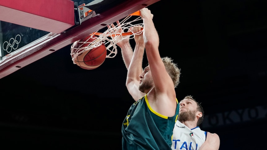 Jock Landale dunks with Nicolo Melli behind him.